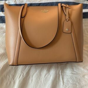 New Kate Spade tote bag. With zipper, back pocket, over shoulder. Color tan.